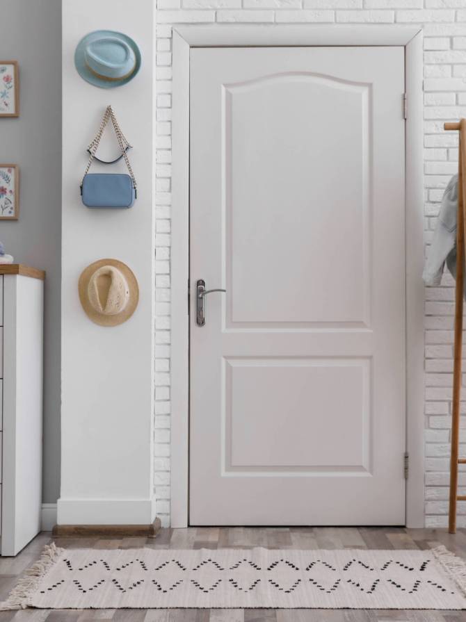 Hallway interior with stylish furniture, clothes and accessories
